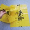 yellow plastic medical trash bag